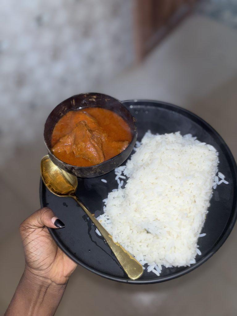 Authentic nigerian chicken stew and a bowl of rice