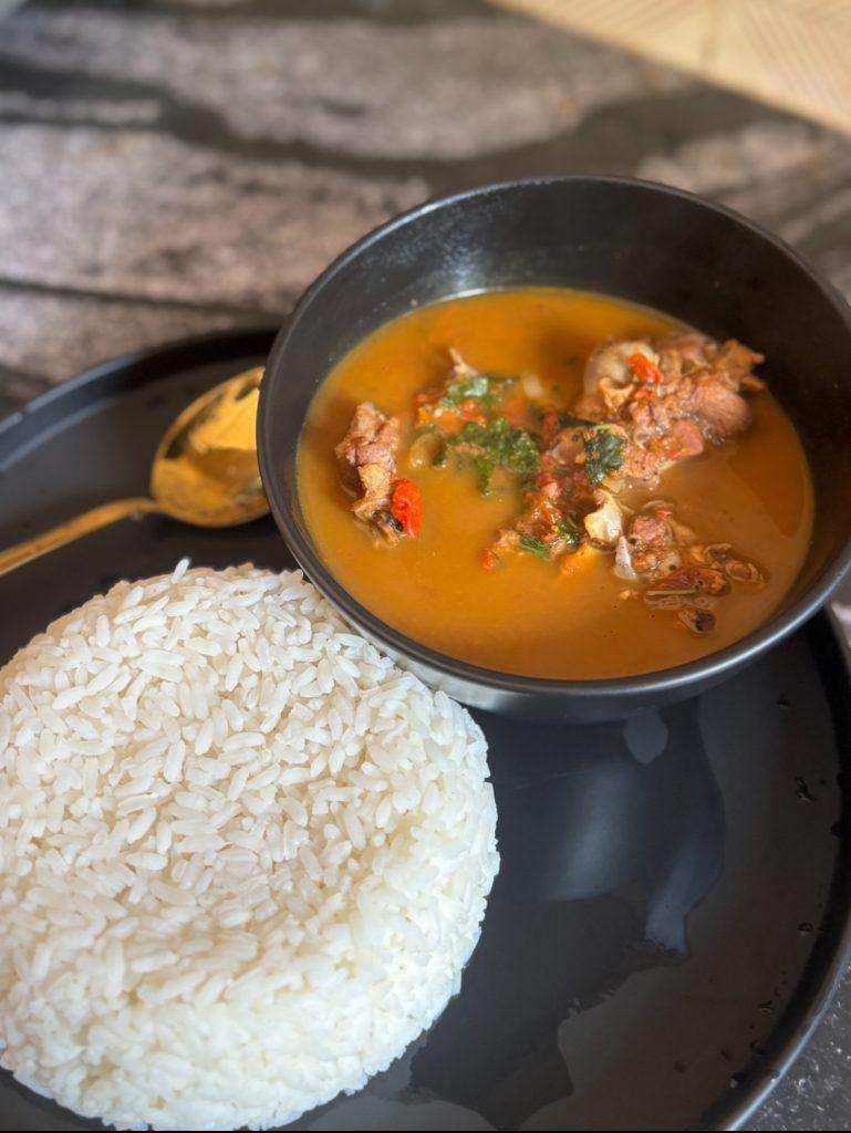 spicy hot bowl of peppersoup and rice