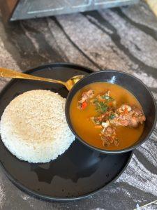 spicy hot bowl of peppersoup and rice